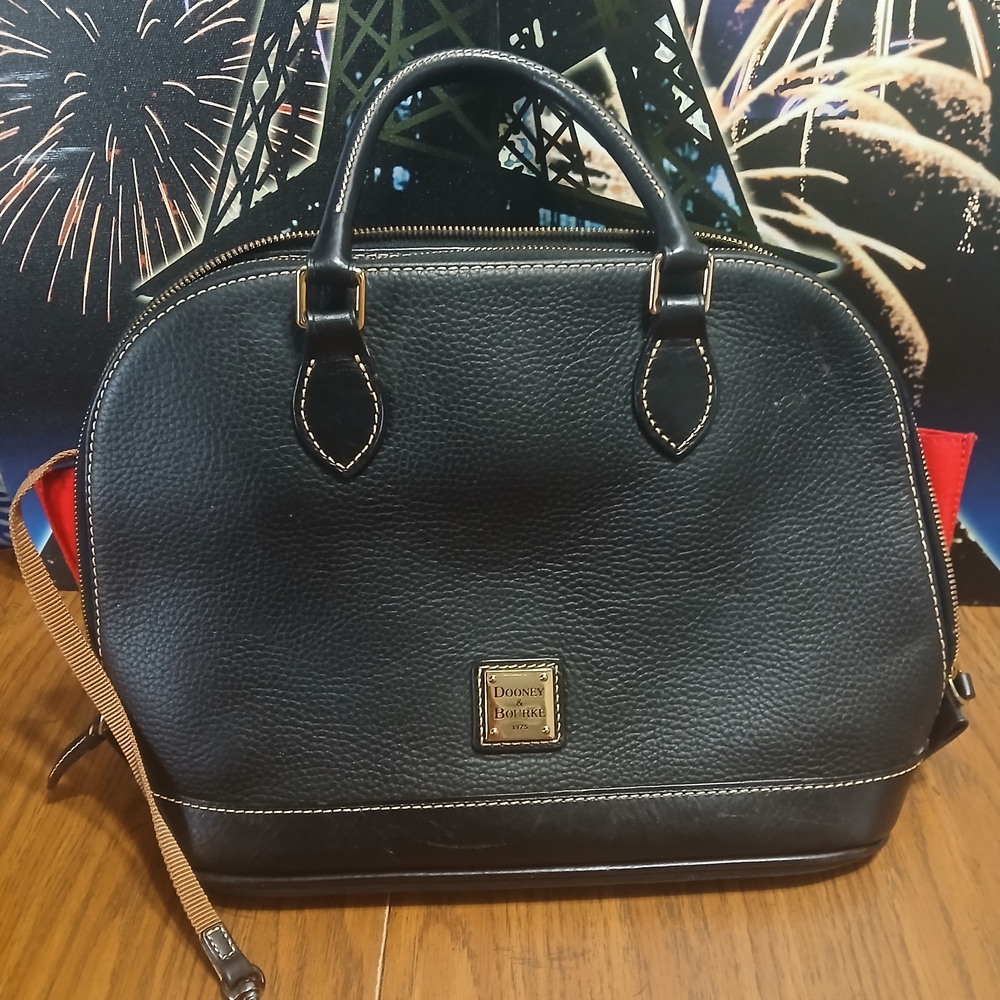 Dooney & Bourke Pebble Grain Zip Zip Satchel in black. 